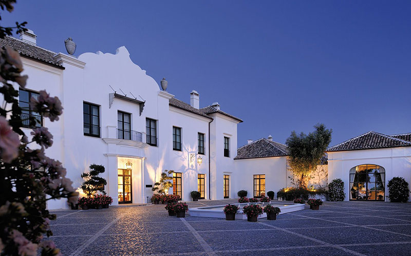 Finca cortesin hotel entrance at dusk