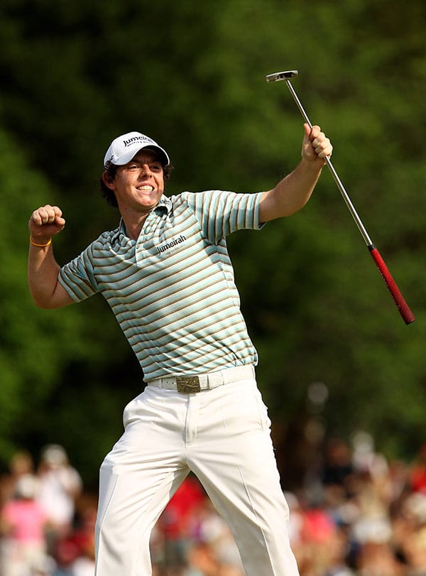 Rory McIlroy of Northern Ireland celebrates has he holes a birdie putt on the 18th green to secure victory during the final round of the Quail Hollow Championship at Quail Hollow Country Club on May 2, 2010 in Charlotte, North Carolina. (Photo by Richard Heathcote/Getty Images)