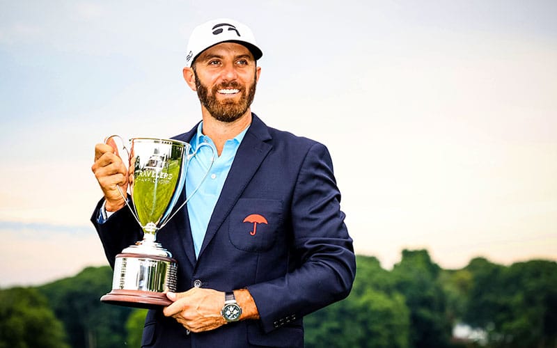 Dustin Johnson of the United States poses with the trophy after winning the Travelers Championship at TPC River Highlands on June 28, 2020 in Cromwell, Connecticut. (Photo by Rob Carr/Getty Images)